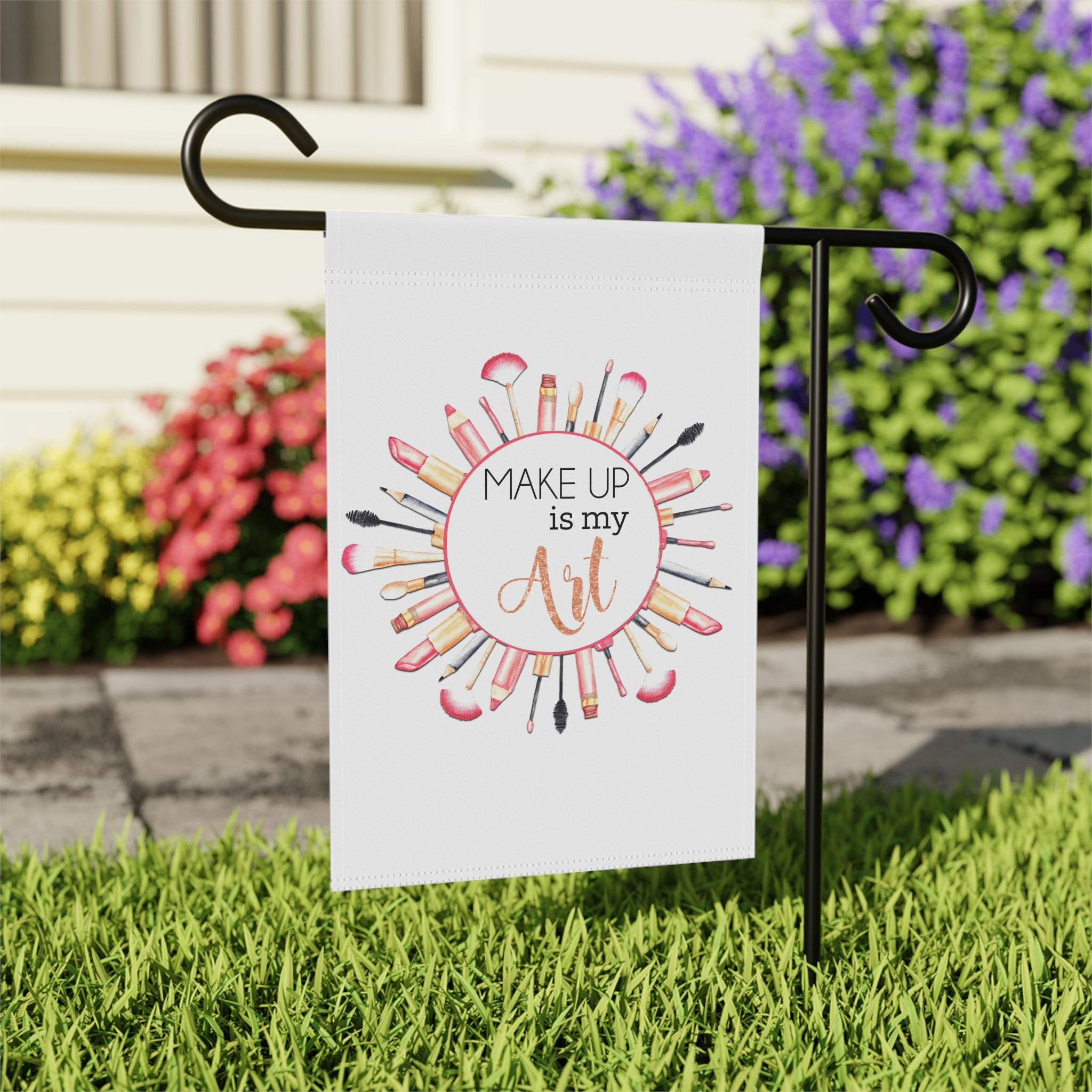 Close-up of Makeup is My Art garden flag with hand-illustrated makeup design