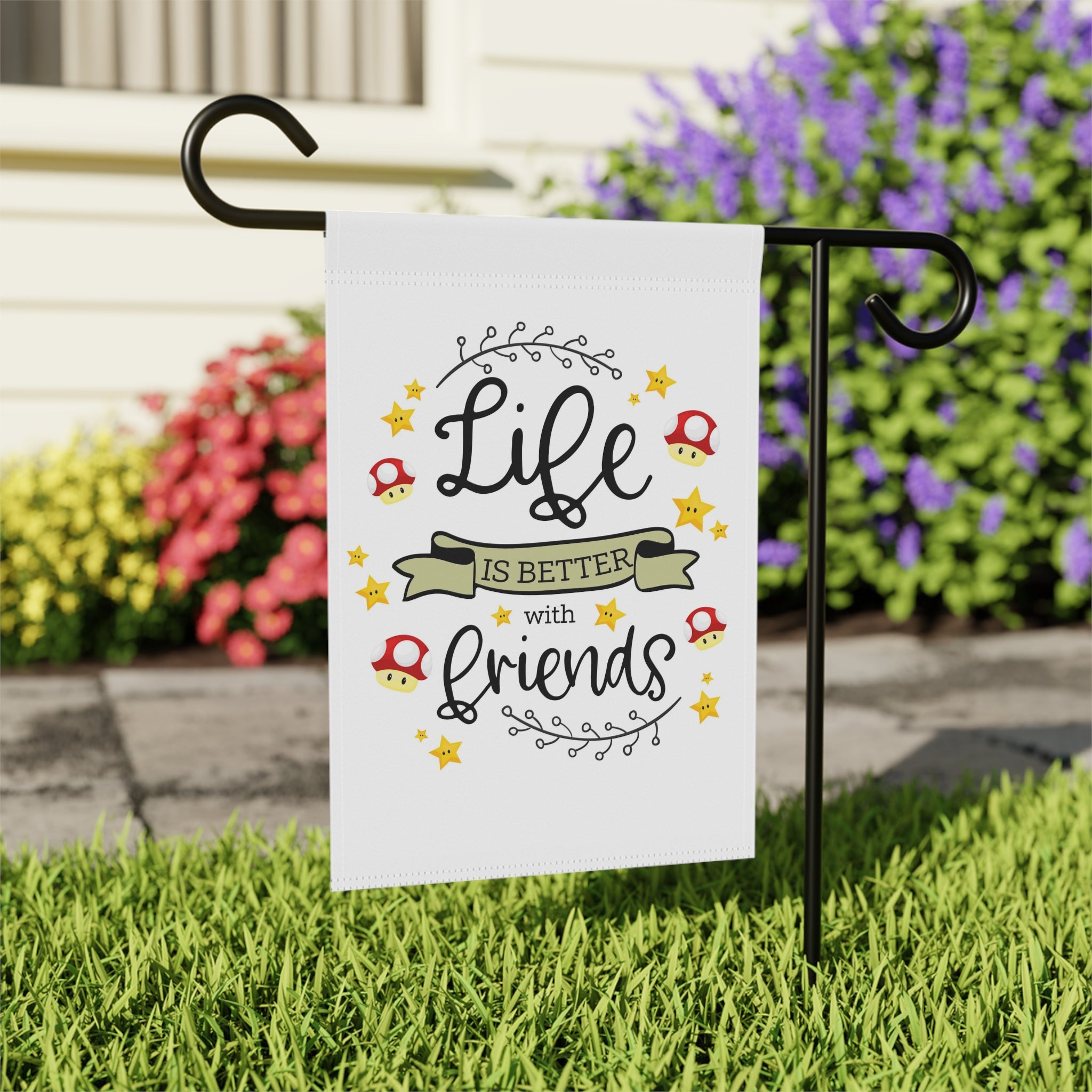 Close-up of Life Is Better With Friends garden flag with retro multiplayer design detail