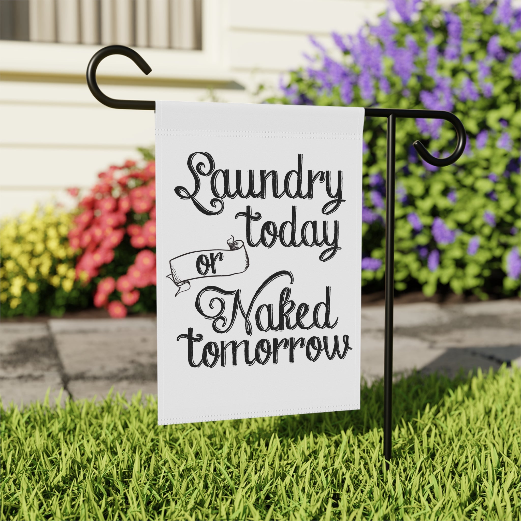 Close-up of Laundry Today Or Naked Tomorrow garden flag with typography
