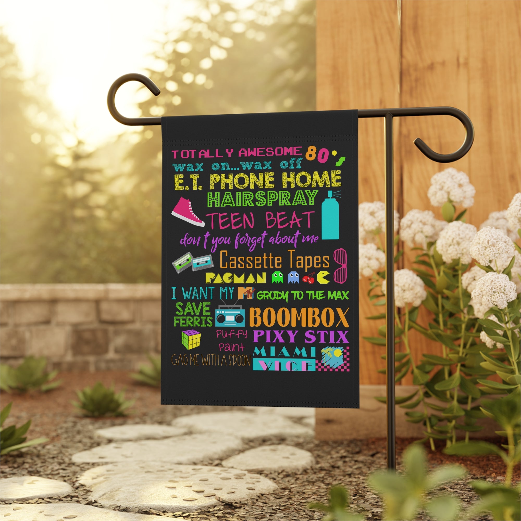 Retro 80s garden flag displayed outdoors on a flag stand