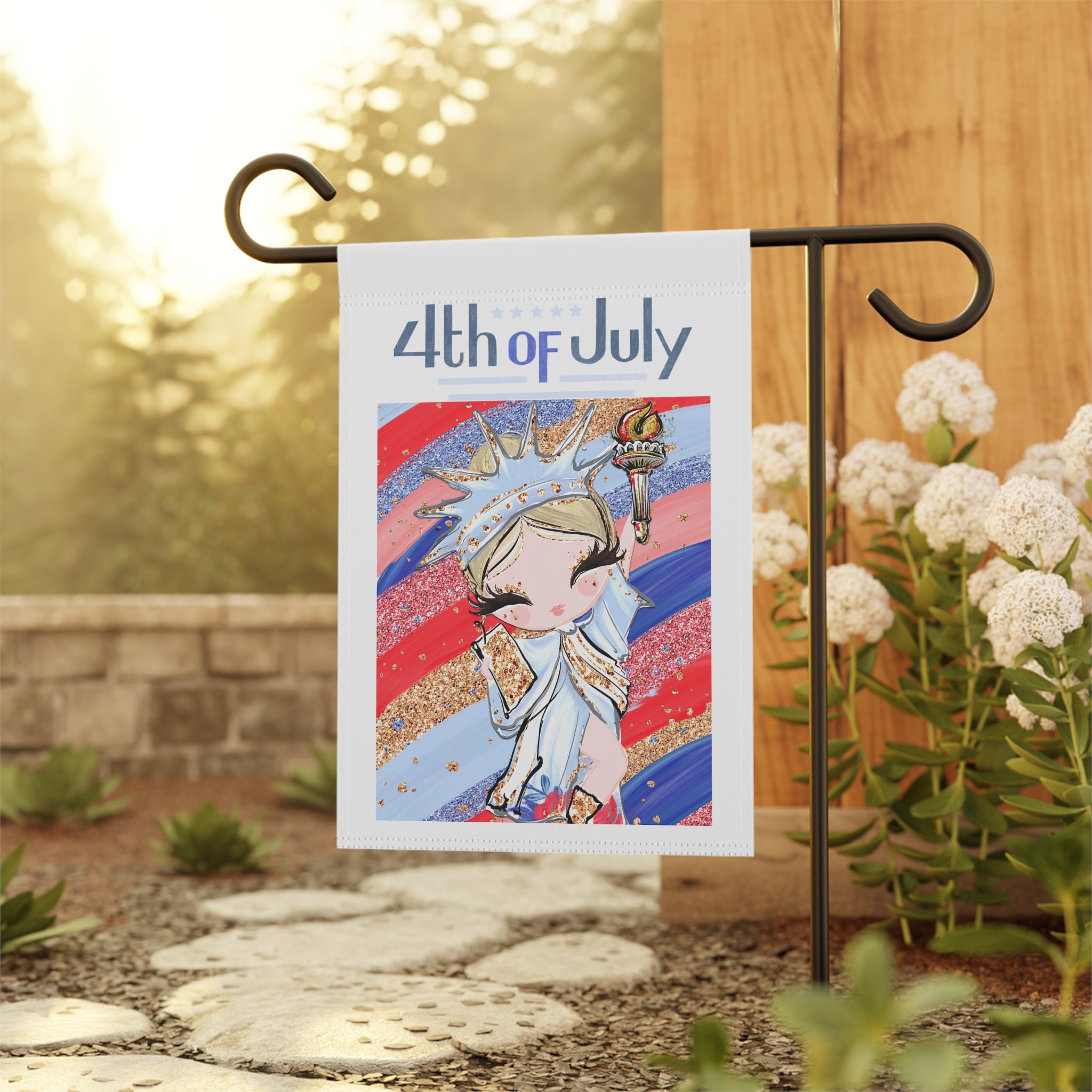 Lady Liberty patriotic garden flag displayed outdoors on a flag stand