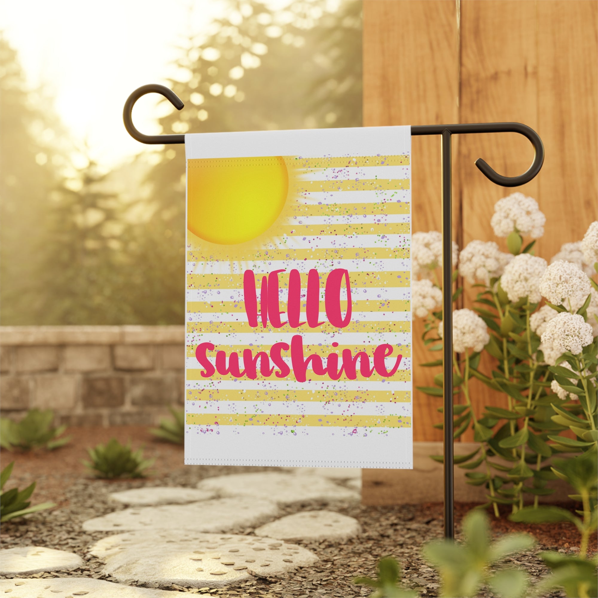 Cheerful yellow Hello Sunshine garden flag displayed outdoors on a porch