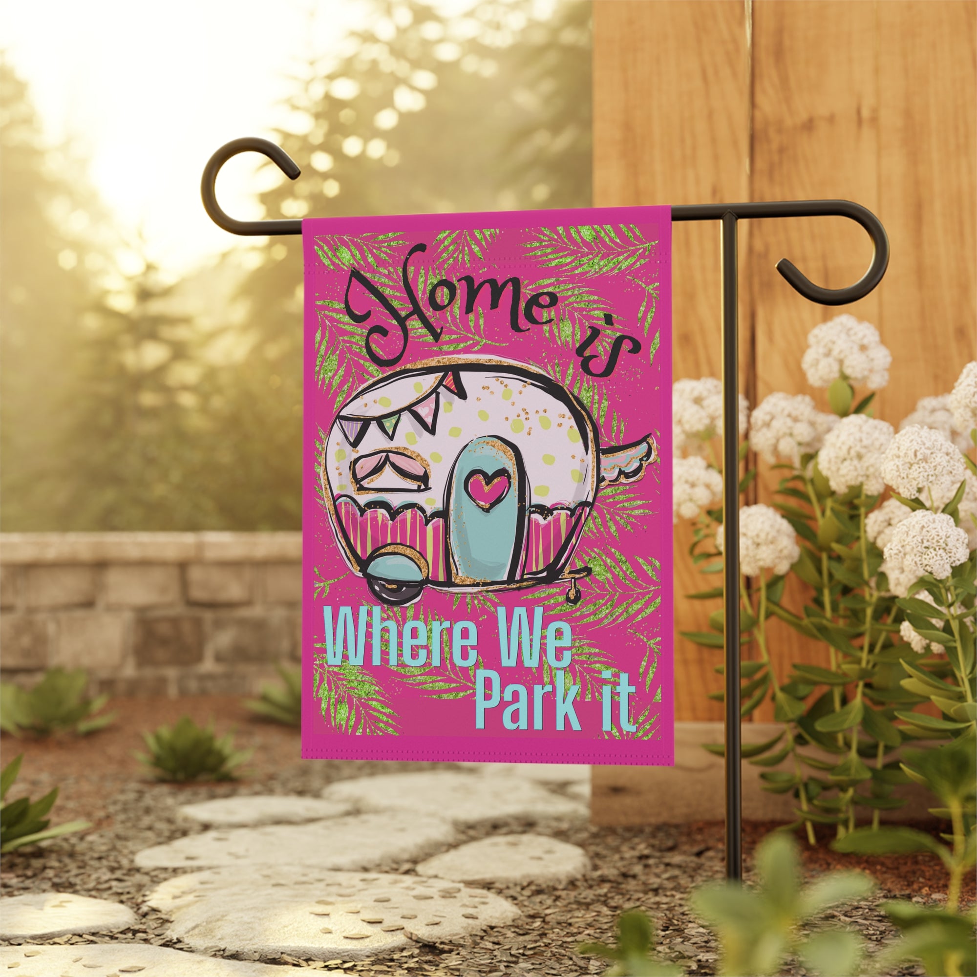 Funny camper life garden flag displayed outdoors at an RV campsite