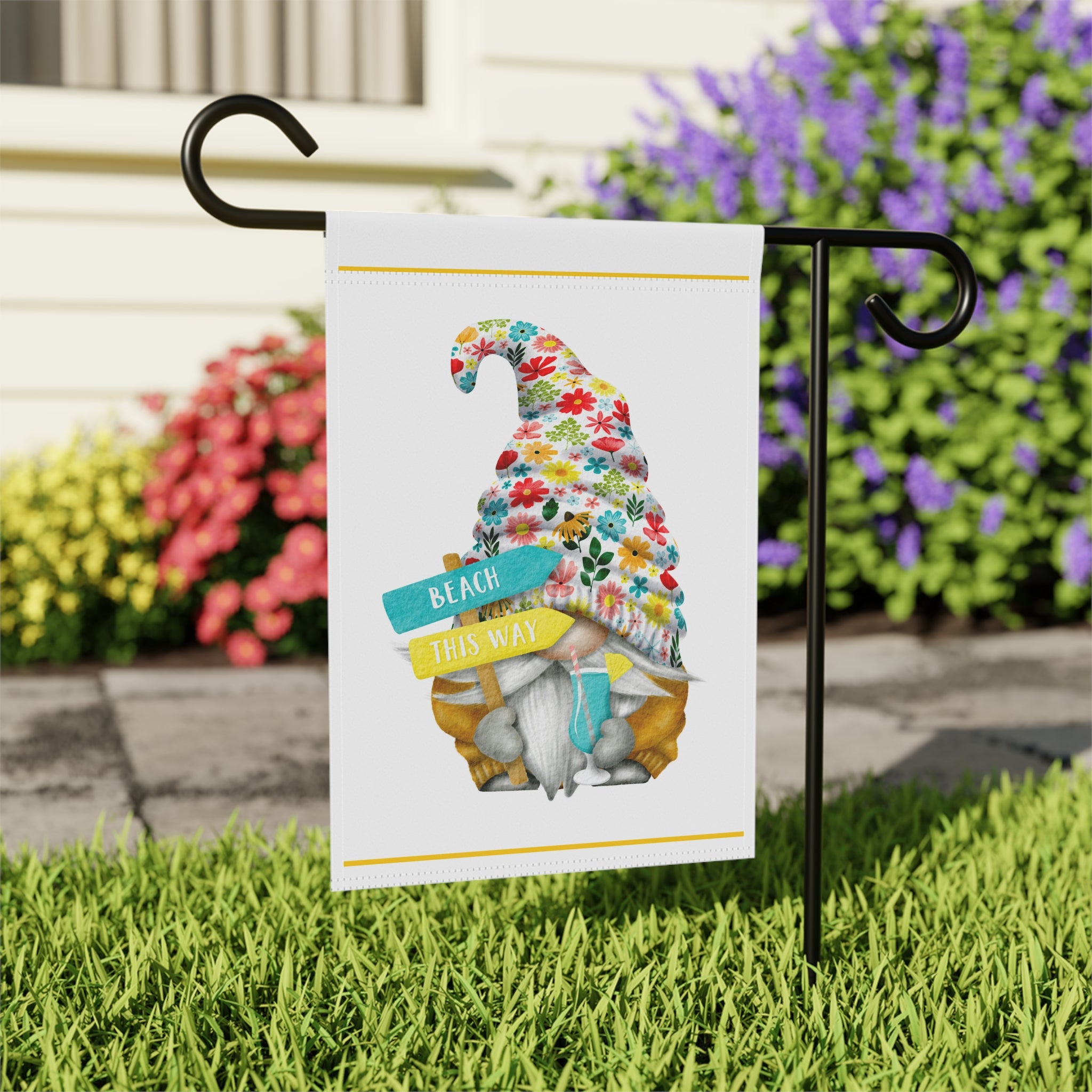 Close-up of Beach This Way Gnome garden flag with hand-illustrated gnome and coastal details