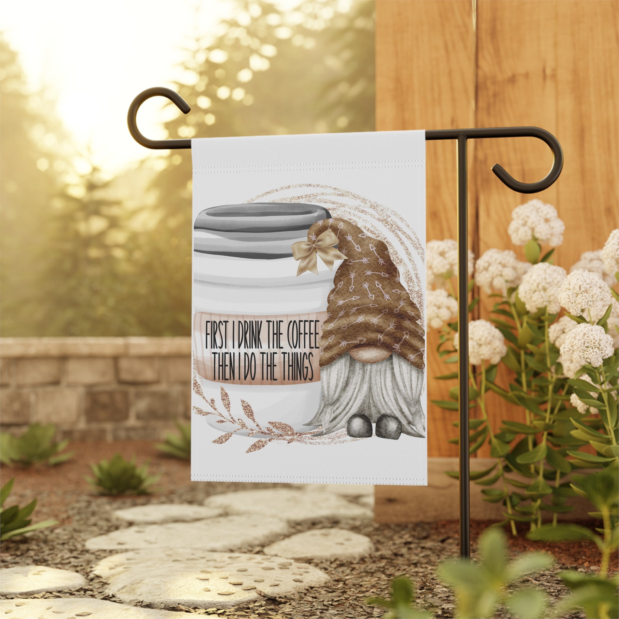 Coffee gnome garden flag displayed outdoors on a porch flag stand