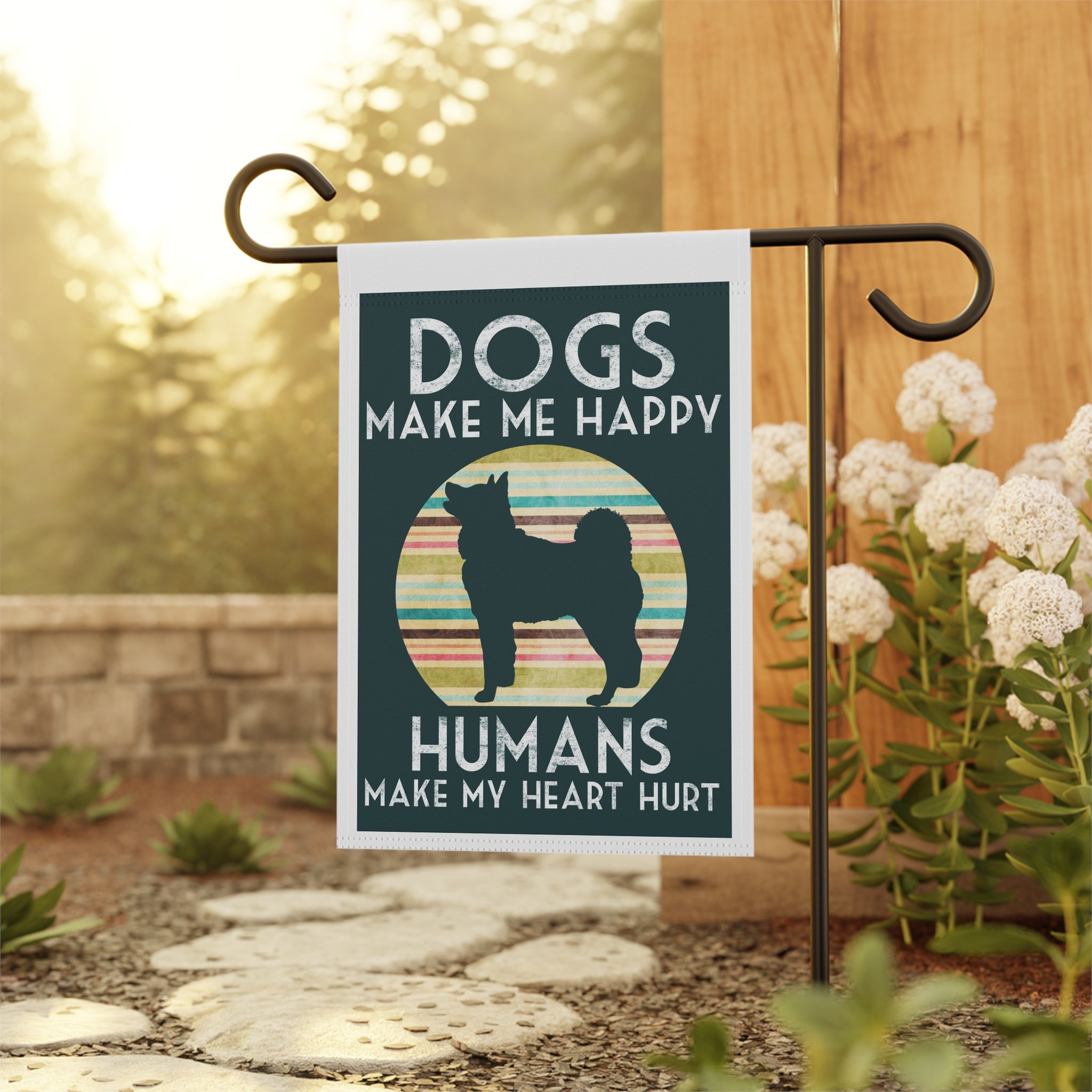 Close-up of Dogs Make Me Happy garden flag with retro typography detail