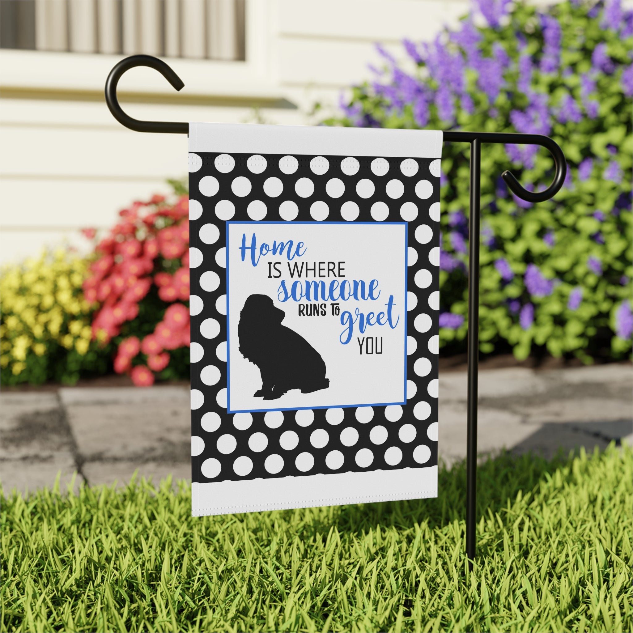 Close-up of Home is Where Someone Runs to Greet You garden flag with polka dot detail