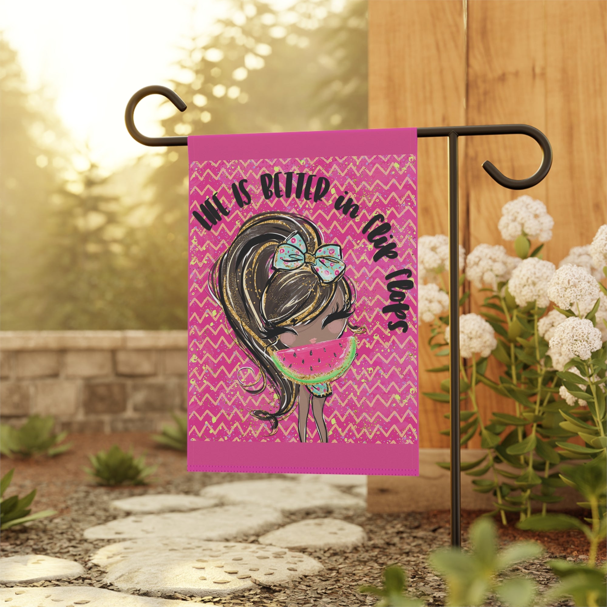 Colorful flip flop summer garden flag displayed outdoors at a beach house
