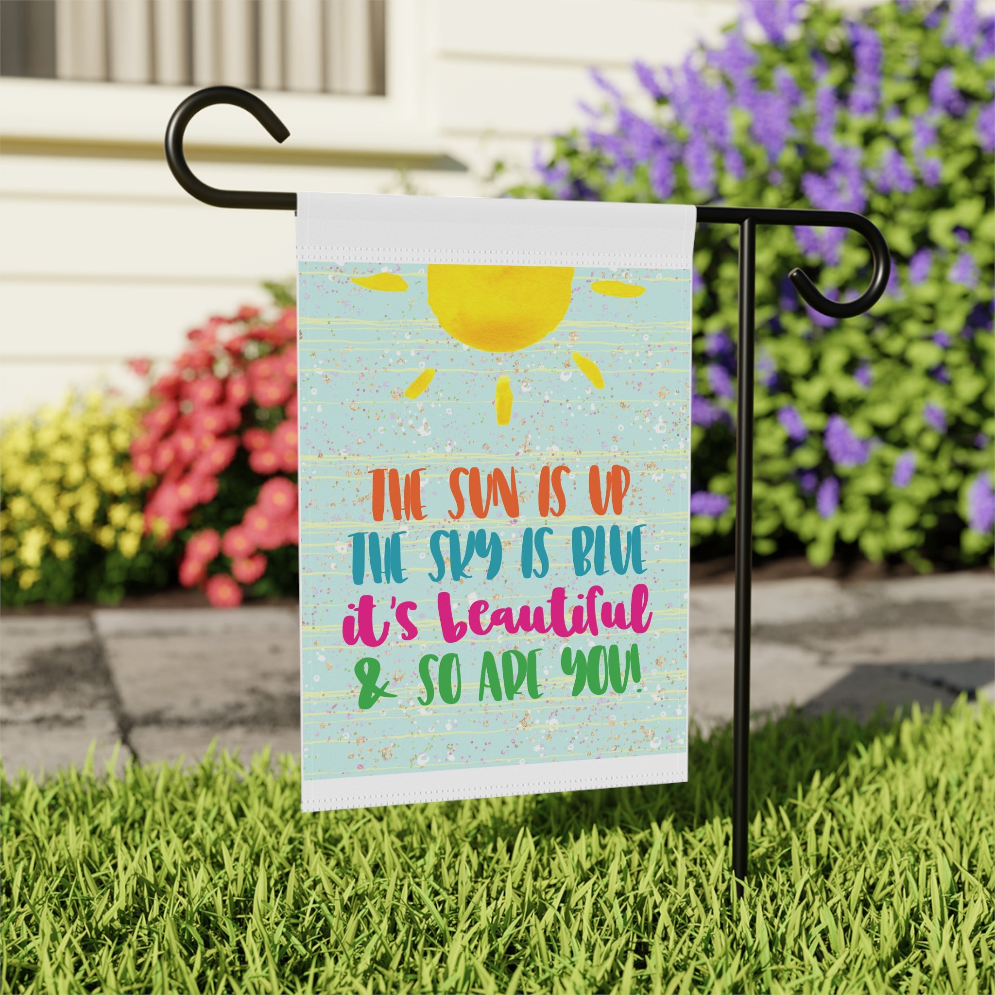 Close-up of Sun is Up Sky is Blue garden flag with sunny typography detail