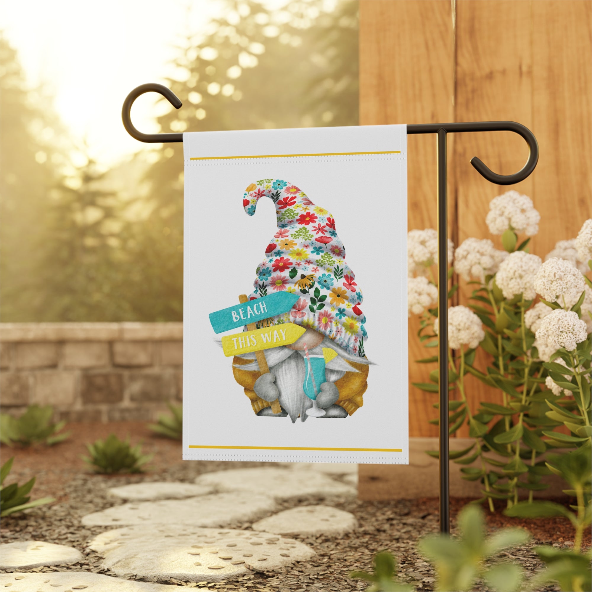 Cute beach gnome garden flag displayed outdoors at a beach house
