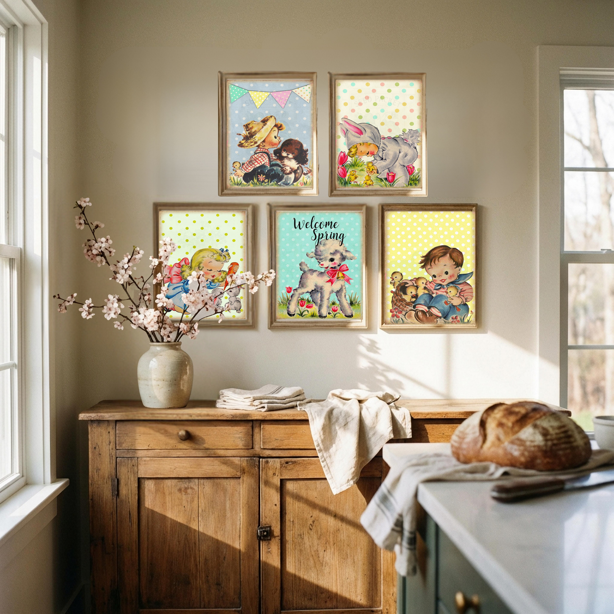 Kitchen with wooden cabinets, a vase of flowers, and framed children's illustrations on the wall.