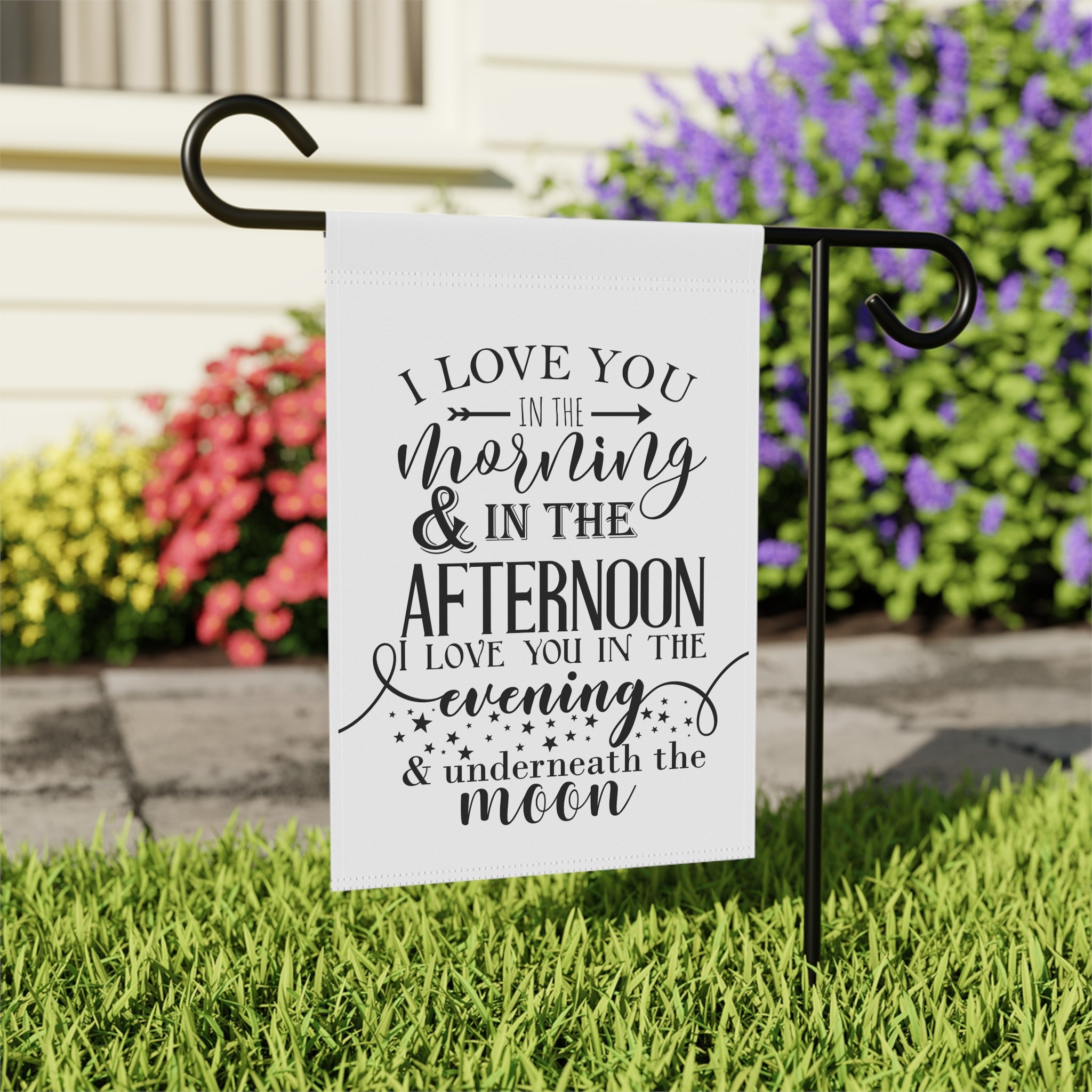 Close-up of Love You Morning and Afternoon garden flag with hand-lettered typography