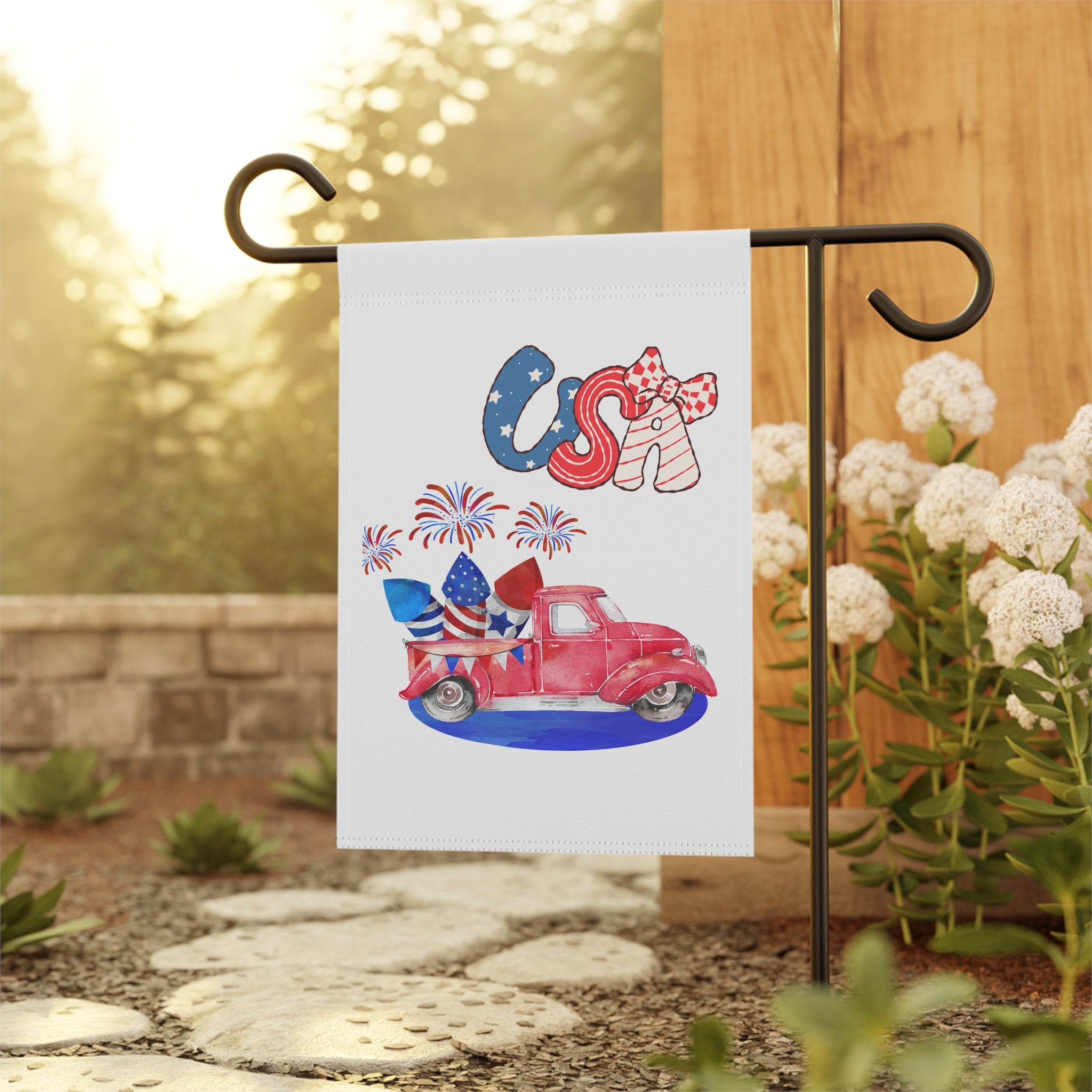Vintage pickup truck patriotic garden flag displayed outdoors on a flag stand