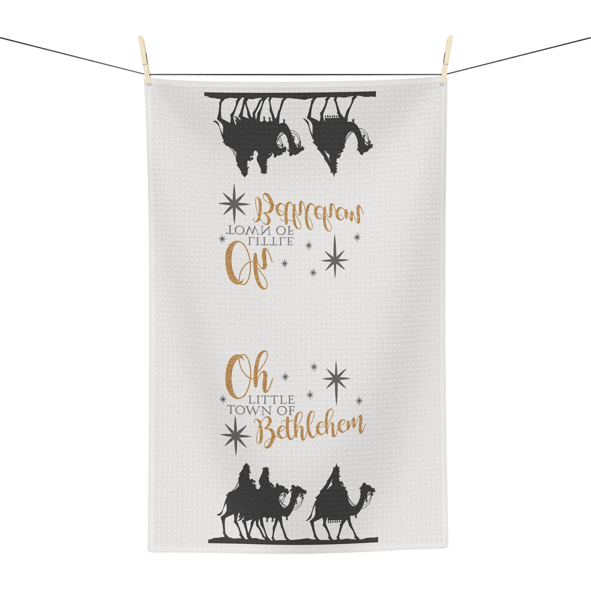 Close-up of Bethlehem carol lettering and star accents on a microfiber Christmas tea towel