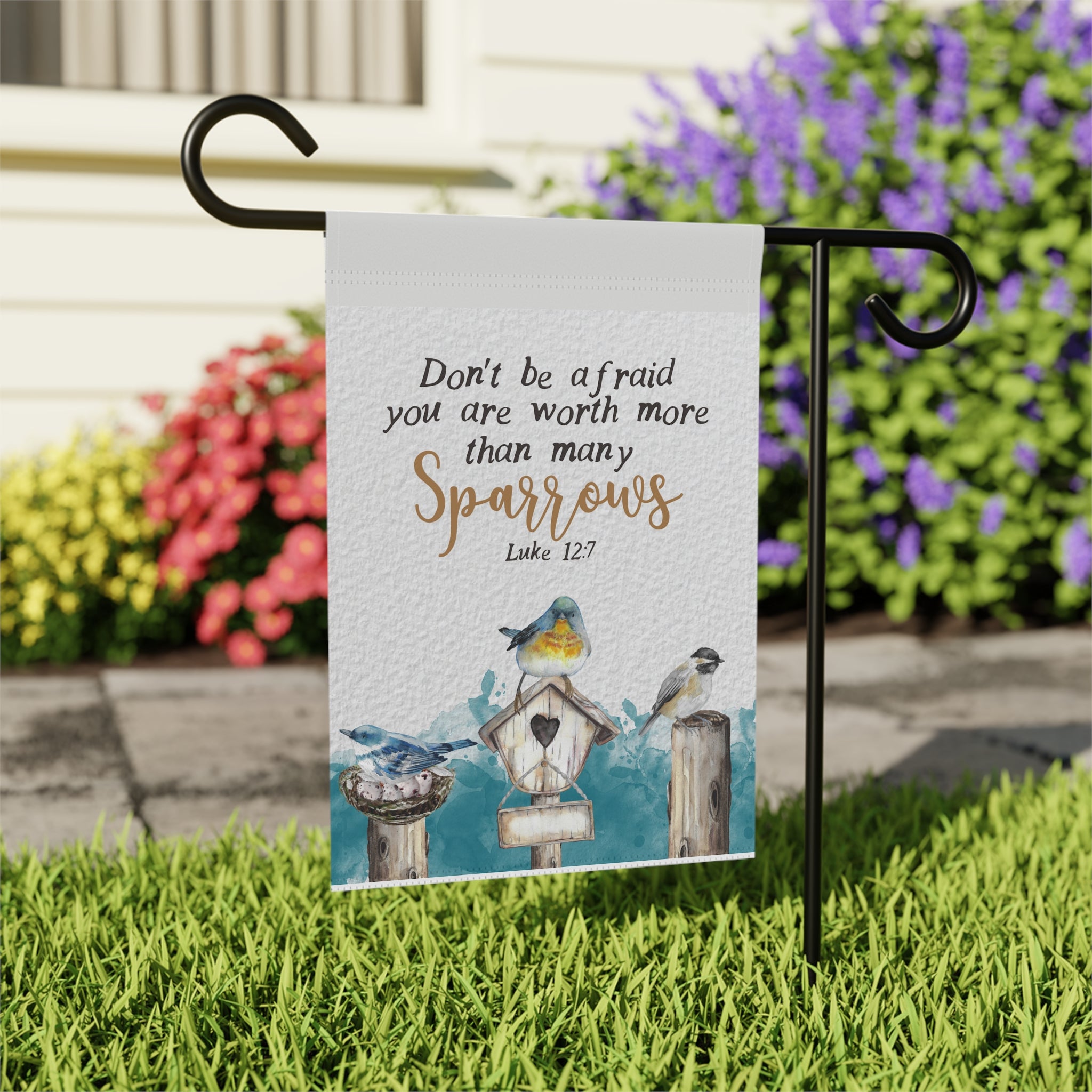 Close-up of Don't Be Afraid Many Sparrows scripture garden flag with bird detail