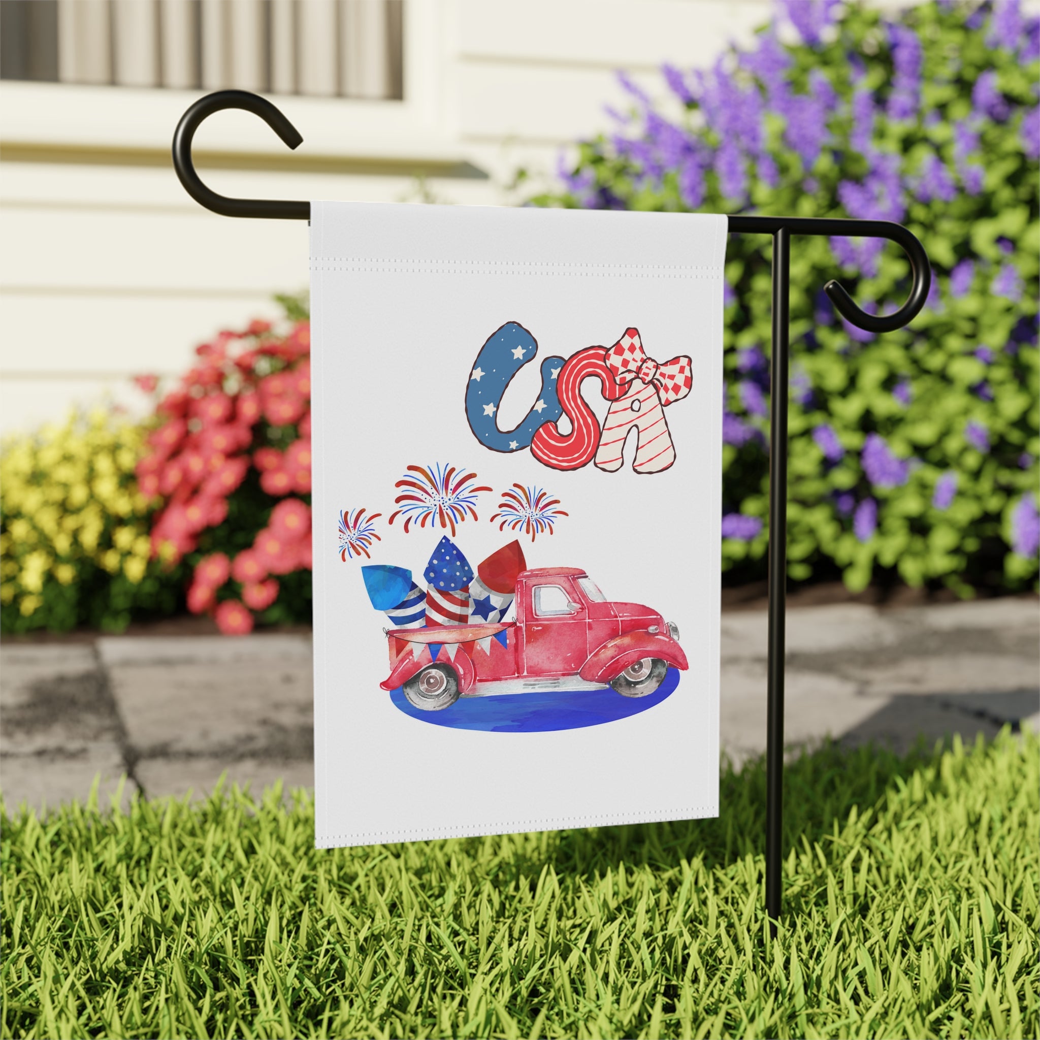 Close-up of vintage USA pickup truck garden flag with stars and stripes background