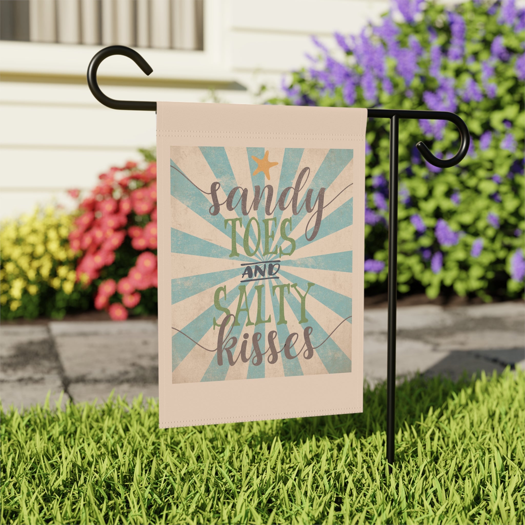 Close-up of Sandy Toes Salty Kisses garden flag with vintage beach design detail