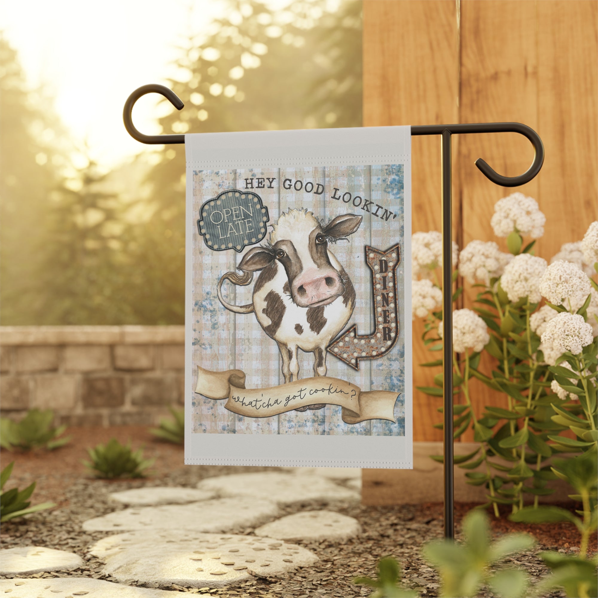 Vintage diner kitchen cow garden flag displayed outdoors on a porch flag stand