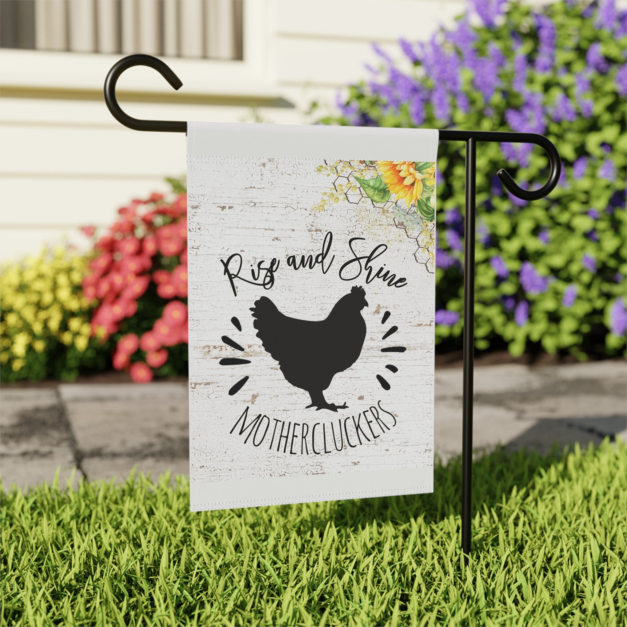 Close-up of Rise and Shine Mothercluckers garden flag with hand-drawn chicken