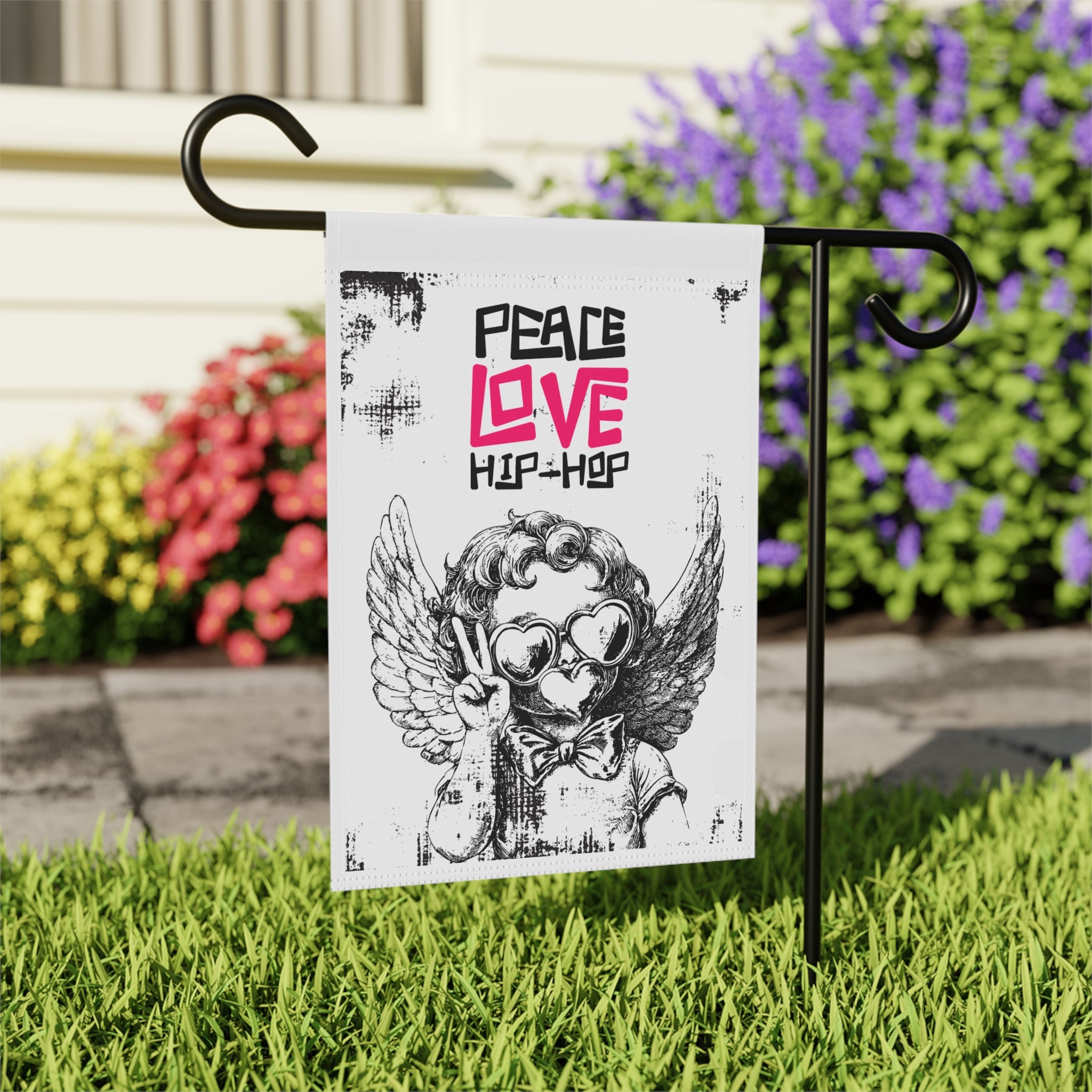 Close-up of Peace Love Hip Hop garden flag with retro music design detail