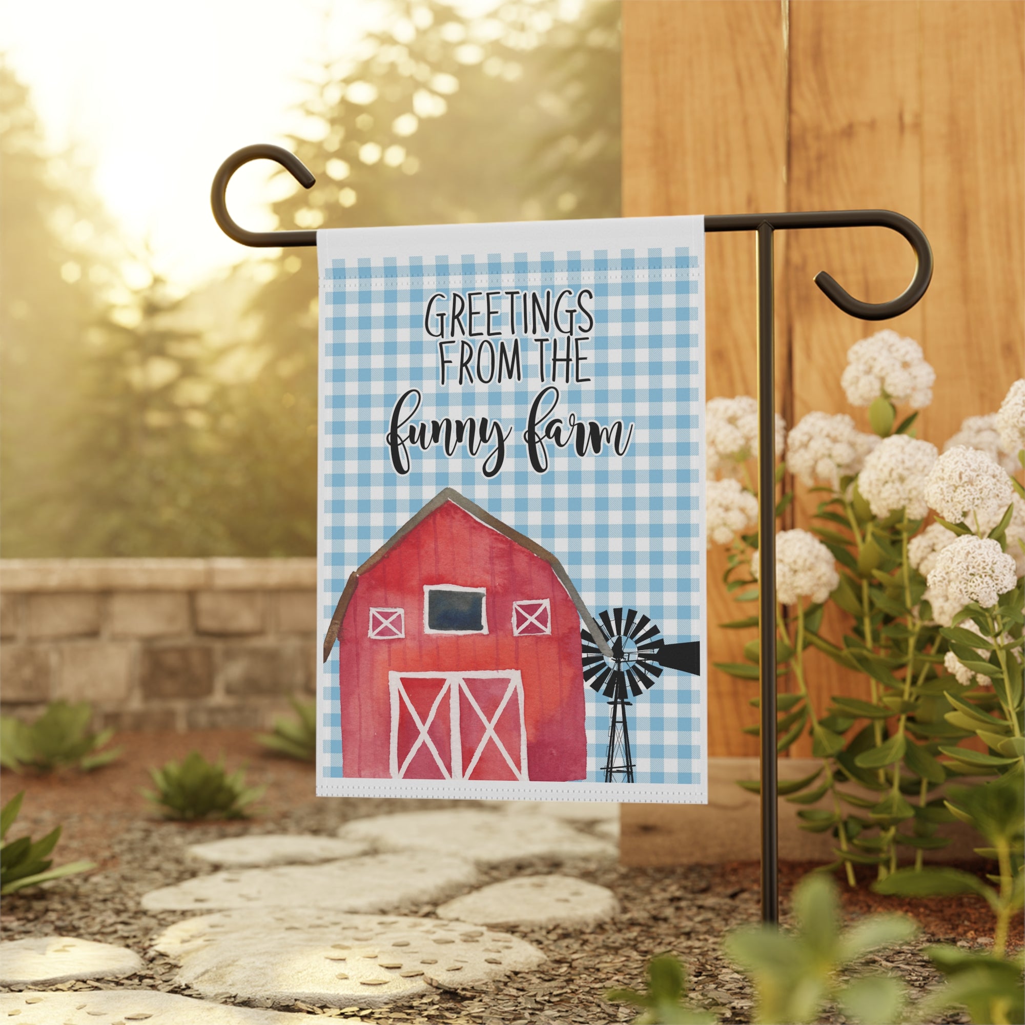 Country funny farm garden flag displayed outdoors on a porch flag stand