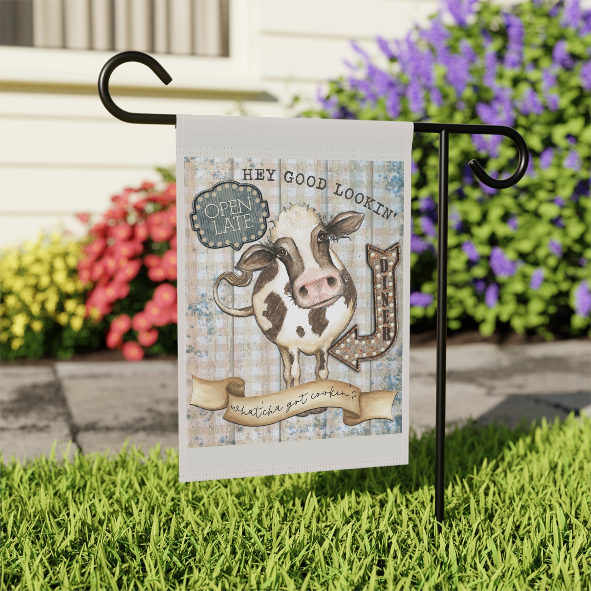 Close-up of Hey Good Lookin' garden flag with diner cow and kitchen design detail