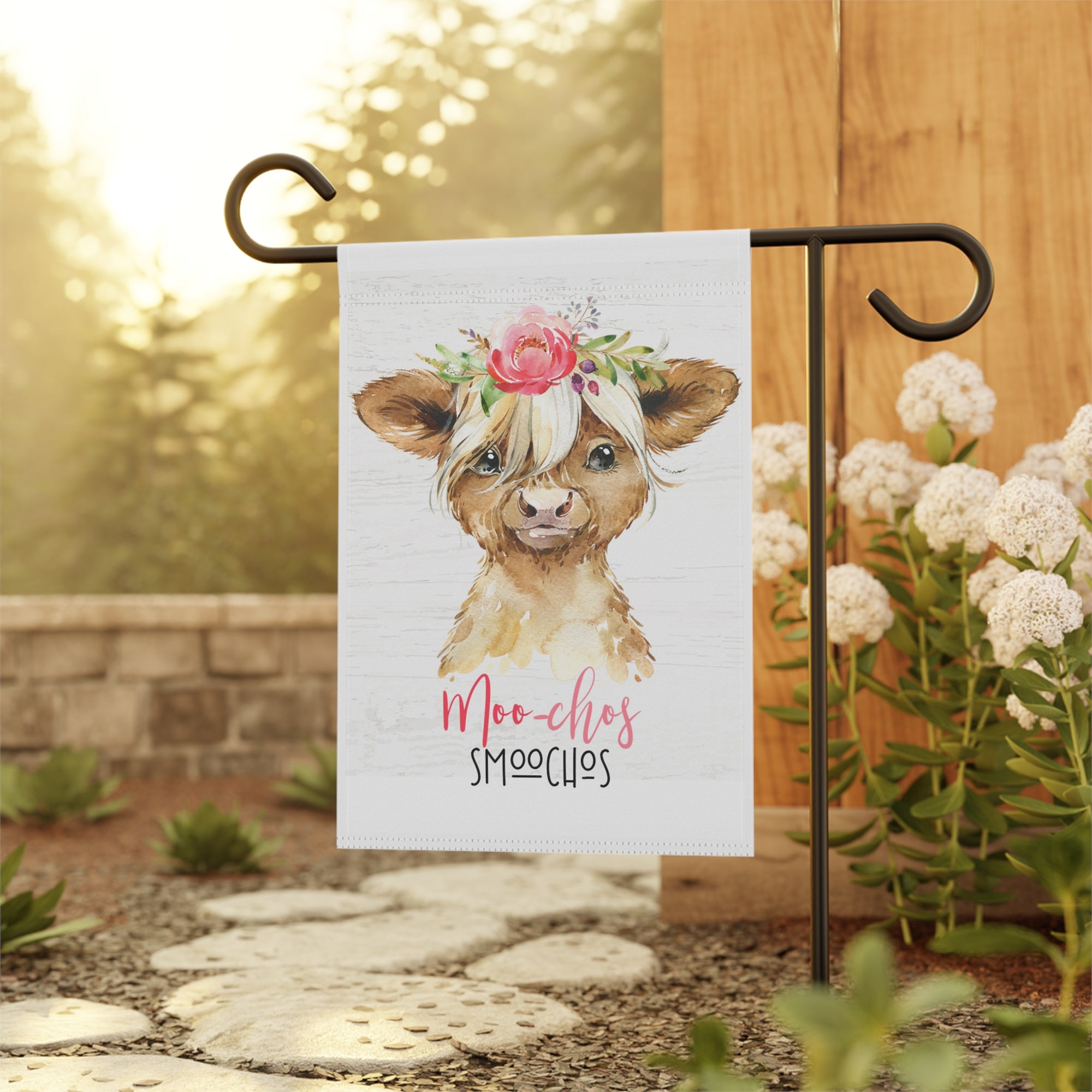 Punny highland cow Moo-Chos garden flag displayed outdoors on a flag stand