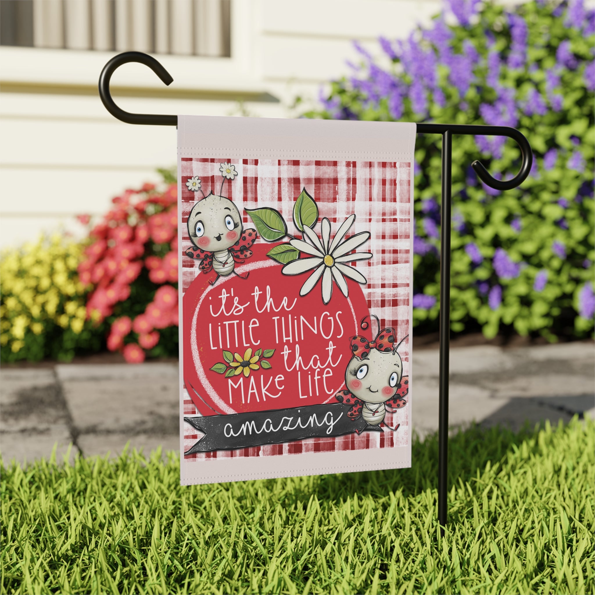 Close-up of It's The Little Things ladybug garden flag with watercolor floral detail