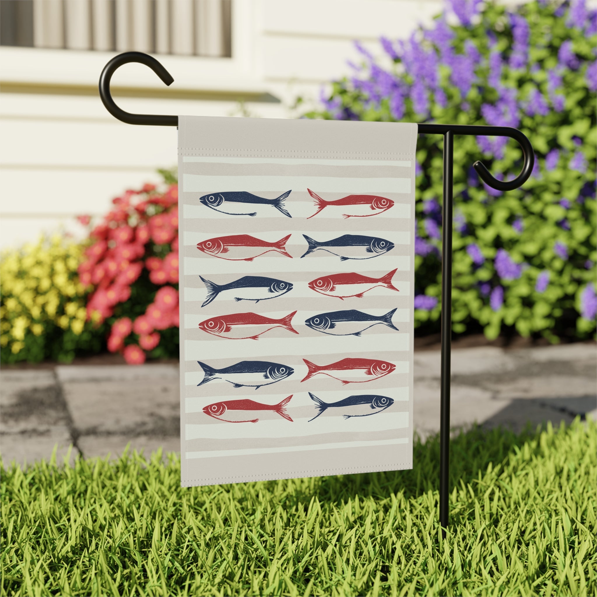 Close-up of nautical fish garden flag with classic New England coastal design