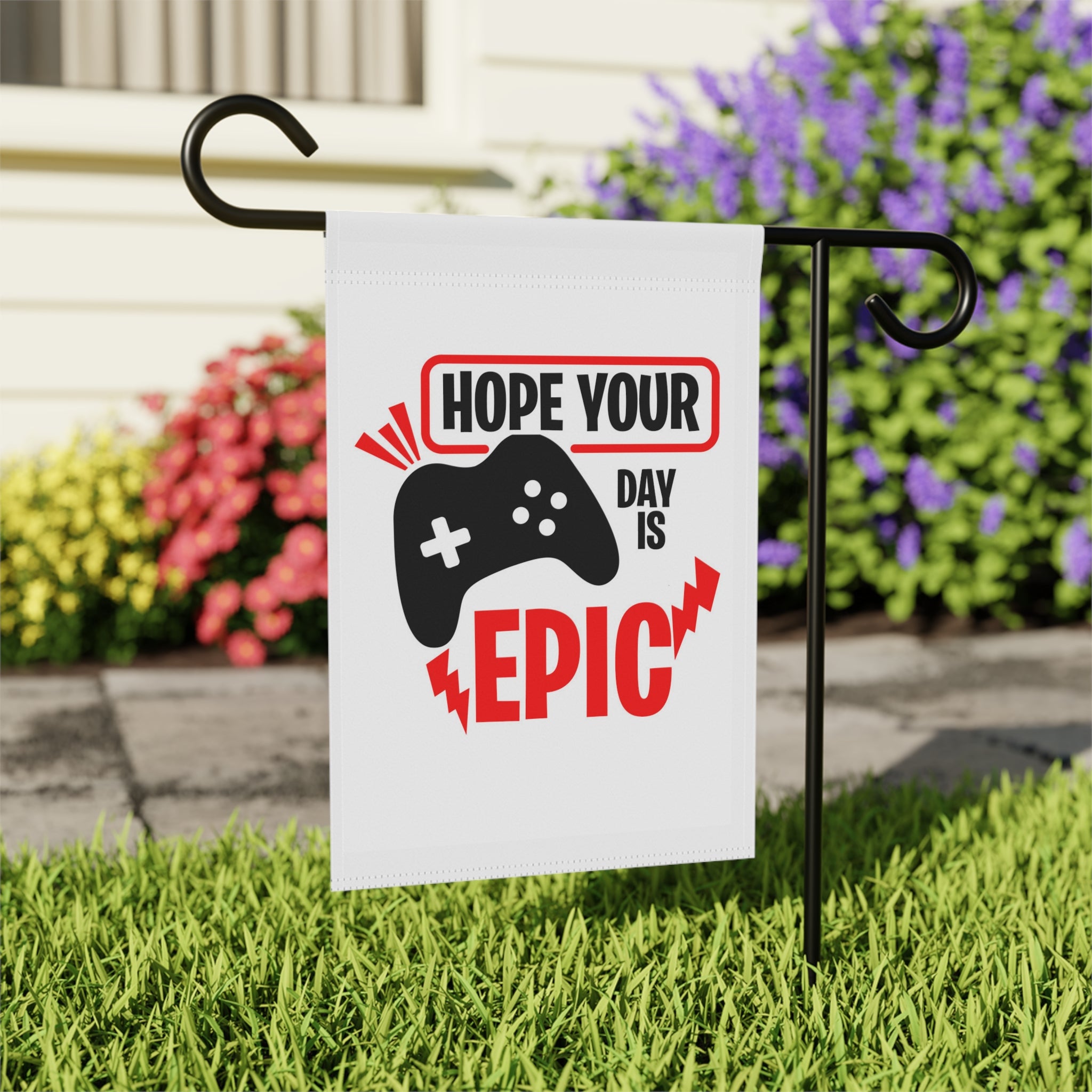 Close-up of Home Your Day Is Epic garden flag with retro 8-bit design detail