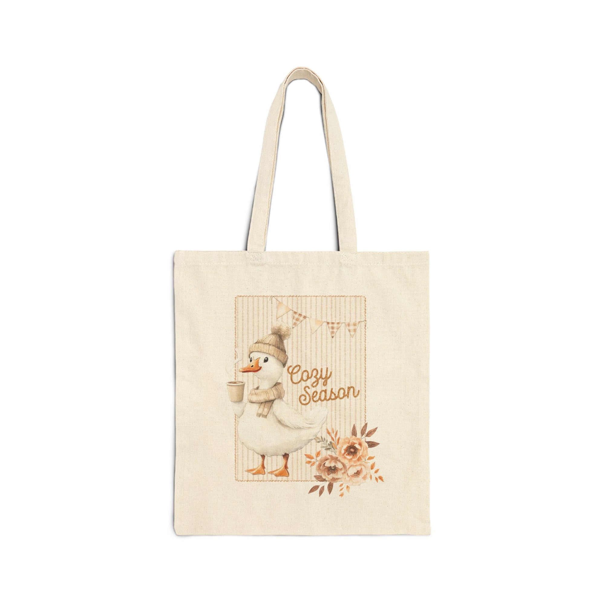 Beige tote bag with a cartoon duck and 'Cozy Season' text on a white background