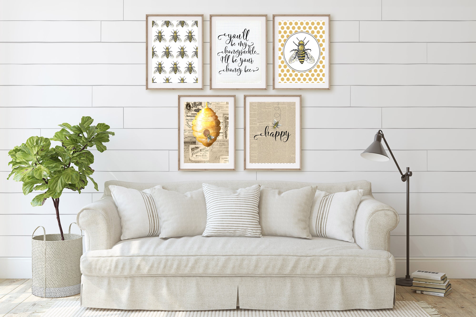 Beige sofa with decorative pillows in a room with framed artwork on the wall.