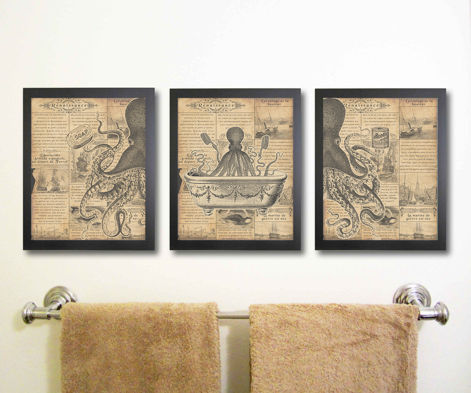 Three framed prints of octopus and bathtub designs above a towel rack with towels.