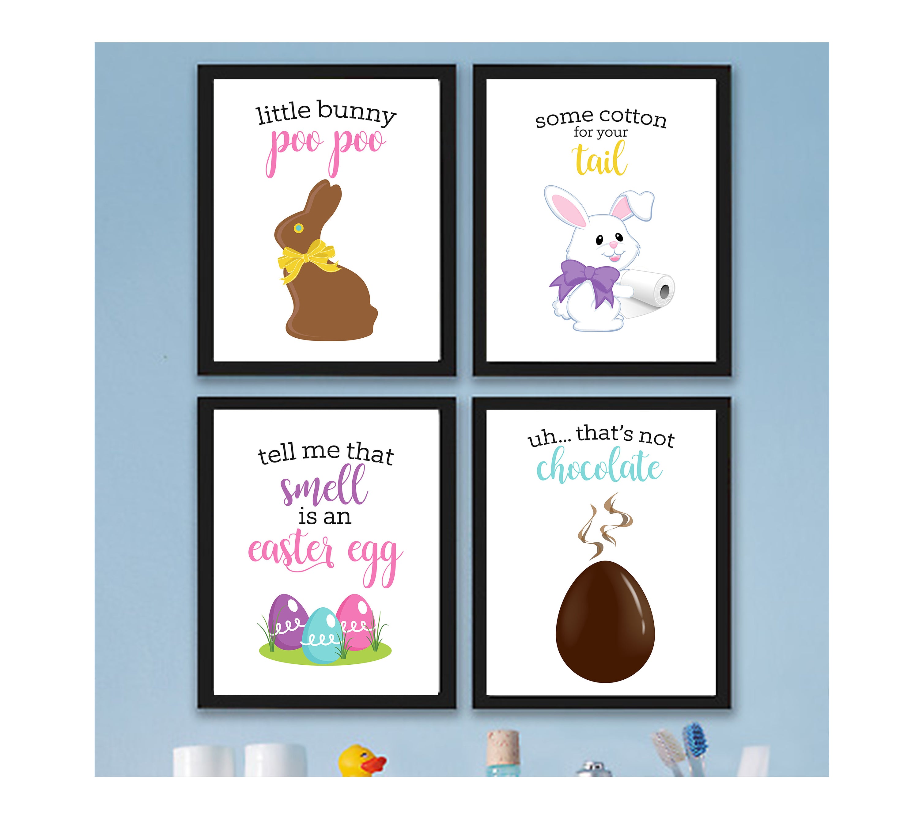 Four framed Easter-themed prints on a light blue wall.