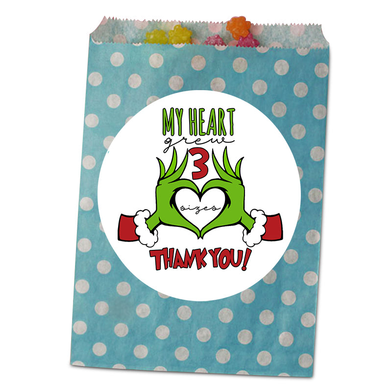 Polka dot goodie bag with 'My heart grew 3 sizes, thank you!' design on a white background