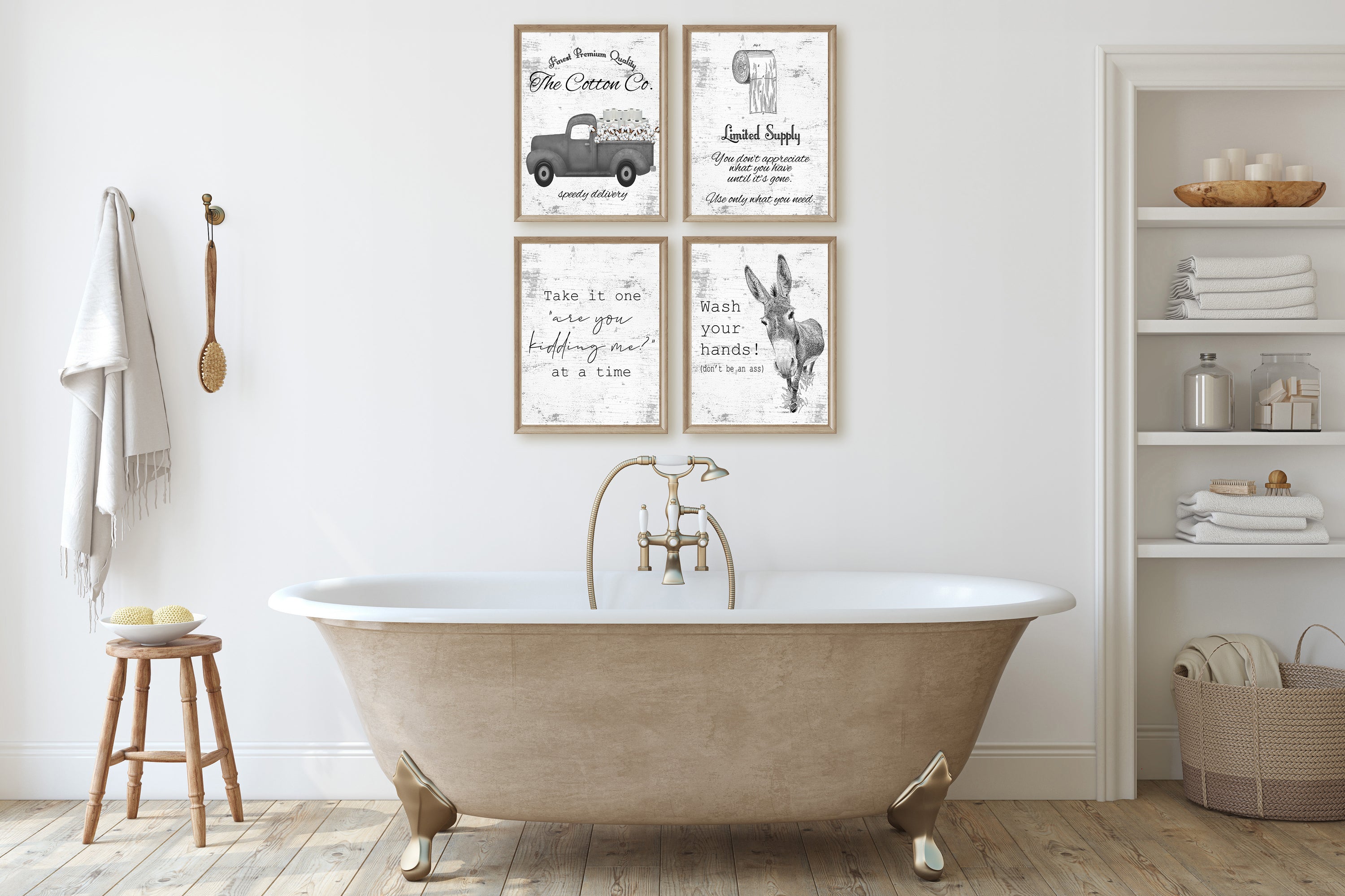 Bathroom with freestanding bathtub, wooden stool, and framed artwork on the wall.