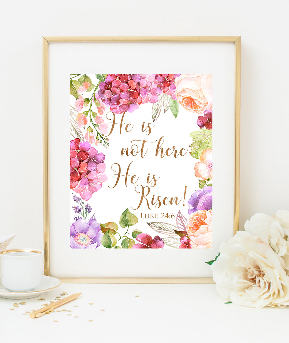 Framed artwork with floral design and text 'He is not here, He is Risen!' on a white background.