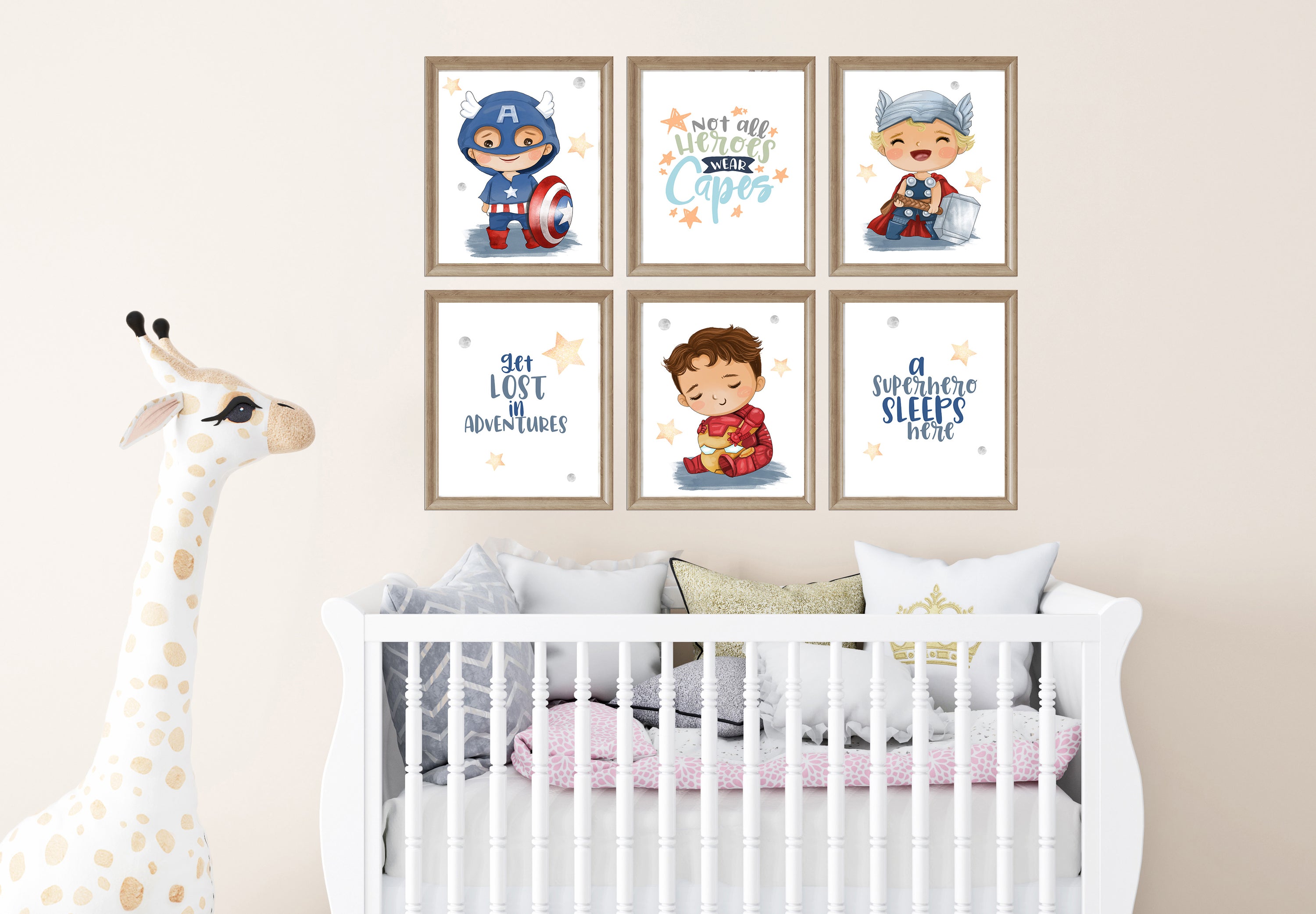 Nursery room with framed children's posters on the wall above a crib.